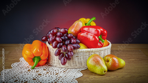 Canvastavla Fresh fruit and bell peppers in a basket