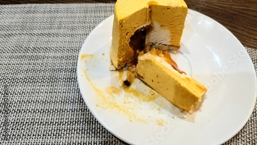 Obraz na plátne mango soufflé with a coconut cream core, fresh whipped cream, and a tangy passion fruit filling, all resting on a coconut flake crust