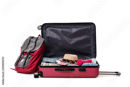 Backpack and open suitcase ...