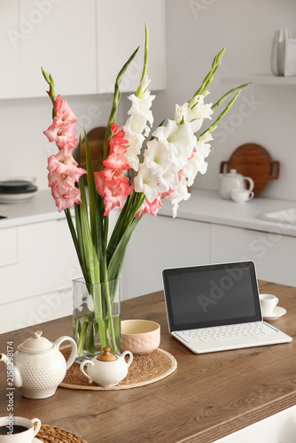 Vase with gladiolus flowers...