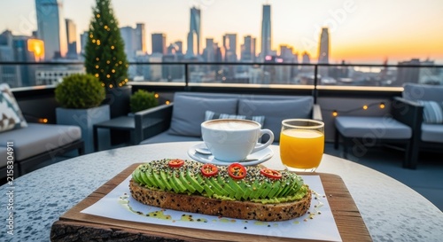 Breakfast on rooftop with city skyline view at sunrise.