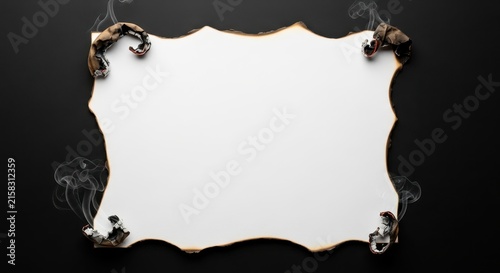 Burnt paper frame with decorative scorch marks on dark background.
