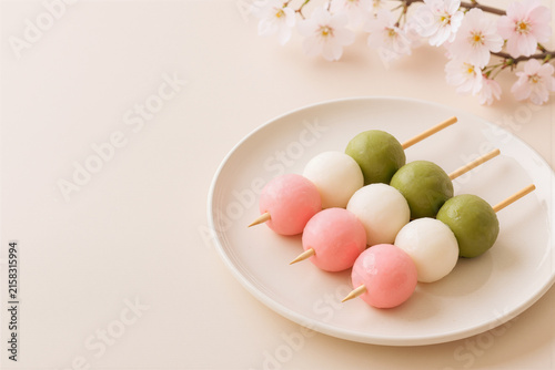 Hanami dango wagashi with cherry blossoms and copy space