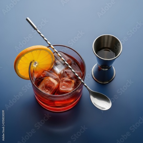 Classic Negroni Cocktail with Garnish and Bar Tools.