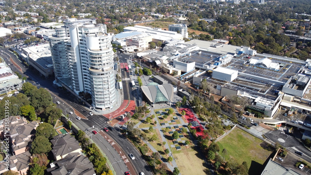 Obraz premium Aerial view of metro station and park below new apartments in Sydney Australia 
