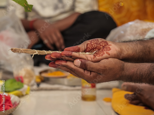 Close-up of Couple Performing Rituals in Traditional Hindu Wedding Ceremony Indian Groom and Bride Holding Sacred Darbha Grass During Hindu Wedding Rituals