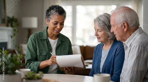 Financial advisor with senior couple discussing documents