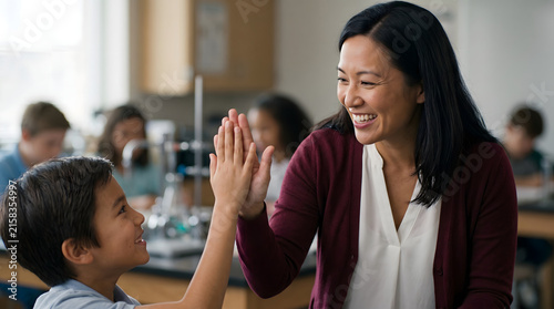 Teacher and student high five in science lab