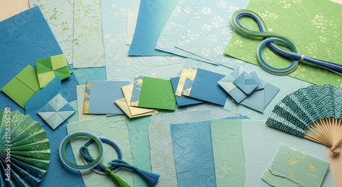 Colorful craft supplies and tools on light background.