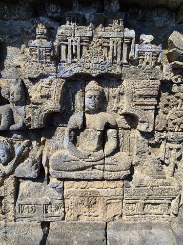 Konstfotografi Bas-relief sculpté représentant Bouddha, détail architectural du temple de Borob