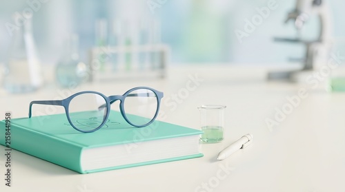Glasses and book on a laboratory desk