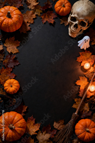 Halloween Still Life With Jack O Lanterns, Skull, Ghost, Candles, Witch Hat and Autumn Leaves

