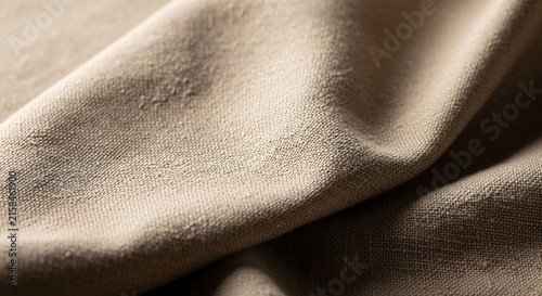 Beige fabric fold textile surface macro texture showing soft cloth material detail for background design