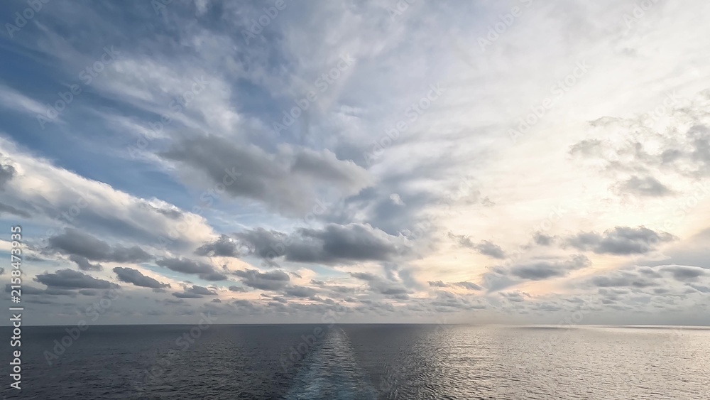 Fototapeta premium Stunning sunset over calm ocean from cruise ship
