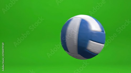 Realistic volleyball spinning and flying through the air against a bright green screen background with smooth rotating motion
