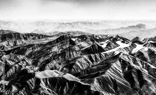 Photography Black and white rugged mountain range with dramatic peaks