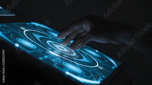 Plakat Hand interacting with glowing futuristic touch screen