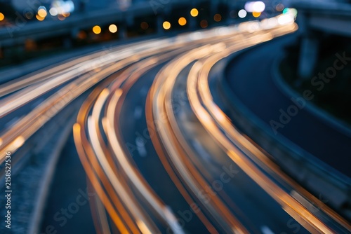 The Highway Light Trails at Night on a Curved Expressway