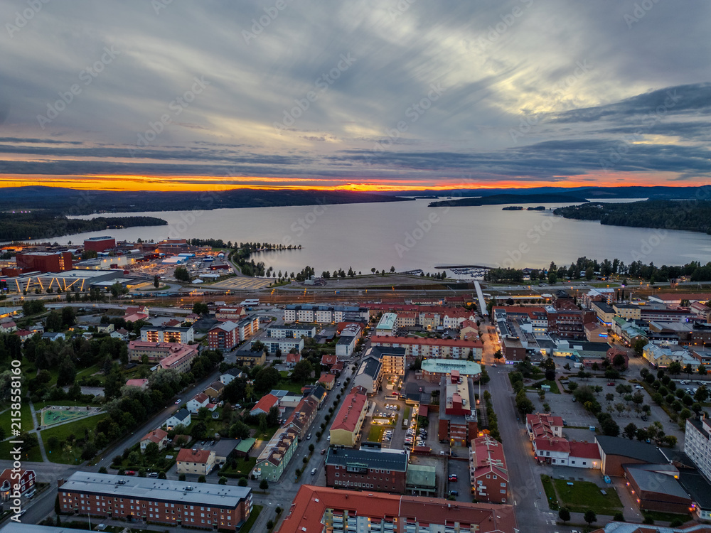 Fototapeta premium Sunset at a lake and a town in Sweden