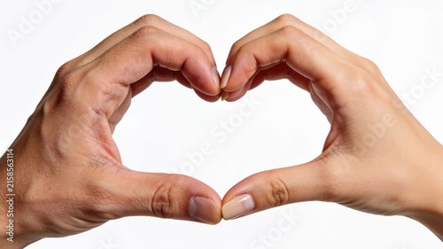 Close-up of a man and woman's hands joining together to form a heart shape gesture on a white background. Romantic, love, relationship and gender unity concept