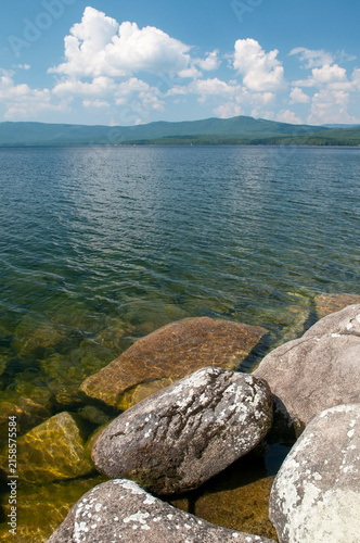 Turgoyak lake in summer with huge boulders on its shoreline, South Urals, Russia