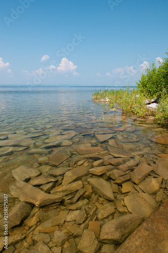 Rocky shoreline of lake Uvildy in summertime, South Ural, Russian Federation