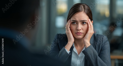 Photo realistic as Businesswoman looking at a failed contract negotiation appearing disappointed - A businesswoman in a formal suit looking at a failed contract negotiation document on concept.