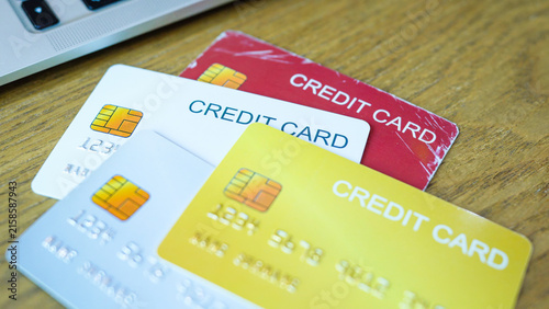 Smart purchasing, Multiple credit cards on wooden surface for business and personal finance. selective focus.