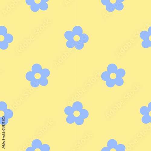Cute seamless floral pattern with simple blue daisy flowers on a pastel yellow background. Playful retro design for wrapping paper, textiles, stationery and backgrounds.