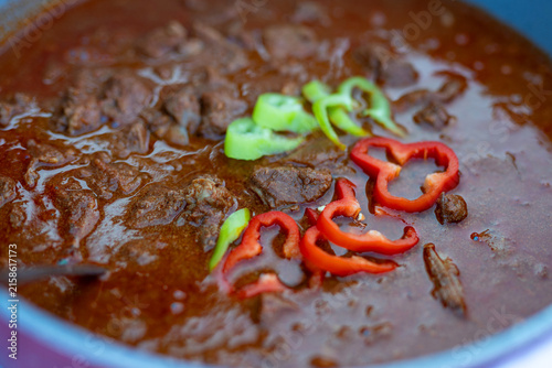 Hungarian beef goulash stew topped with peppers