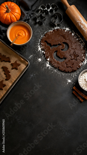 Halloween Cookie Making Background with Chocolate Dough, Baking Tools and Copy Space Vertical