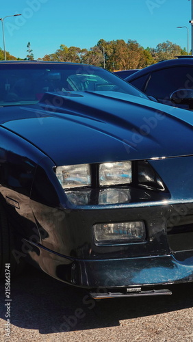 Classic Sports Car Front With Hood Scoop And Headlights