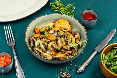 Mussels salad garnished with champignon.