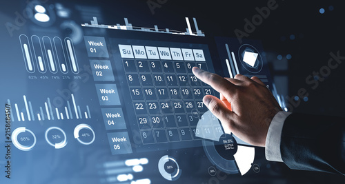 Interactive hologram calendar dashboard with hand selecting dates, analytics charts, progress indicators, and digital planning interface for business management.