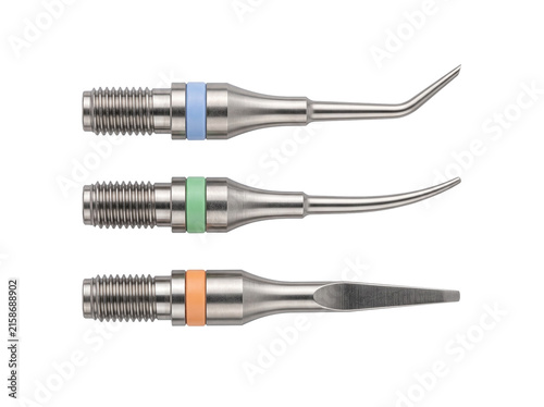 Dental ultrasonic scaler tips metal hygiene tools isolated on white background for professional dentistry teeth cleaning equipment set with color coded bands for endodontic periodic treatment.
