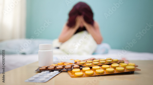 Woman Taking Medicine at Home