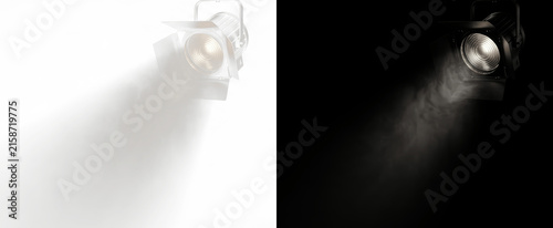 Stage spotlight with dramatic beam and lens flare, professional studio lighting effect on black background for easy compositing, isolated photography element for concert, event, and film production