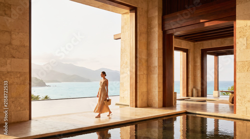 Woman Walking Through Luxury Seaside Resort