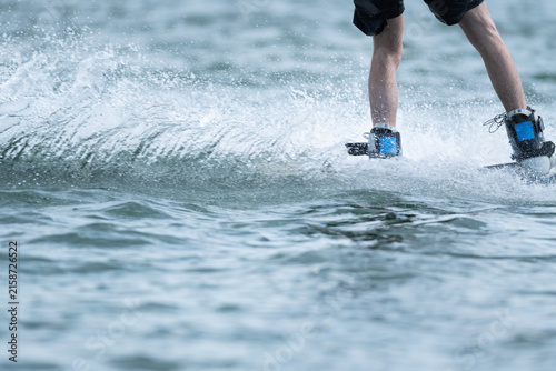 Wake boarder Riding Through Water with Dynamic Splash