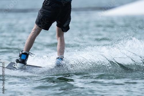 Wakeboarder Riding Through Water with Dynamic Splash