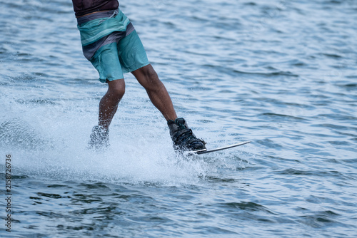Wake boarder Riding Through Water with Dynamic Splash