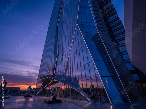 Futuristic Glass Skyscraper Facade at Twilight, Vertical View