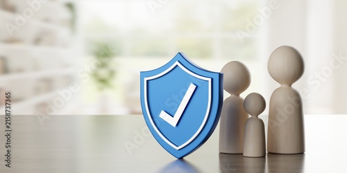 Abstract wooden pawn figure family with blue shield with checkmark on table in front of living room background, family home insurance, security or protection concept with copy space, selective focus