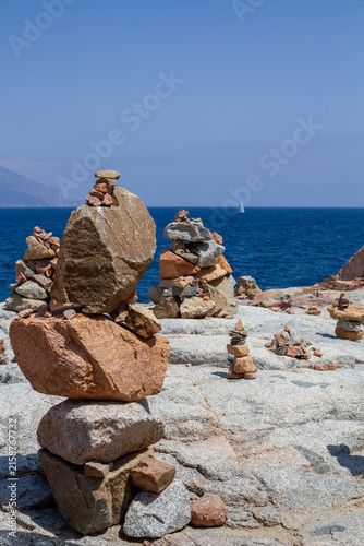 Balanced Stone Sculpture on Sardinia’s Rocky Coast