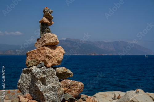 Balanced Stone Sculpture on Sardinia’s Rocky Coast