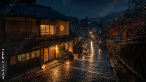 Rainy Kyoto inspired alley with traditional machiya after midnight