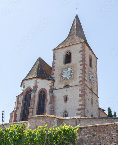 The Church of St. James the Greater in Hunawihr, Alsace France, in the vineyards during the summer