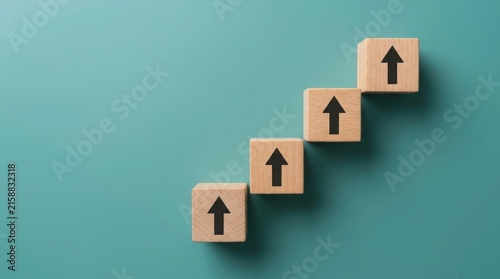 Wooden blocks arranged like a staircase with upward pointing arrows
