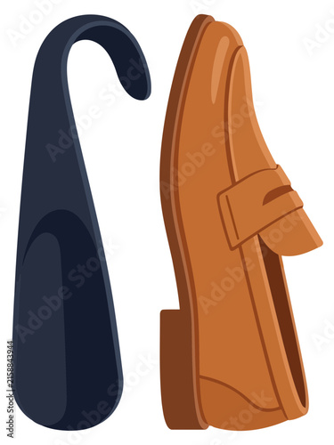 Bild auf Leinwand Shoehorn and a brown leather loafer shoe