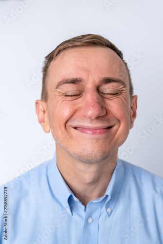 Картината върху платно Man with eyes closed and a genuine, joyful smile, conveying happiness, contentme